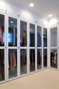 White closet with clear glass inserts
