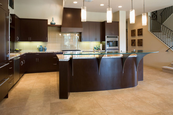 Contemporary kitchen cabinets with raised glass eating bar